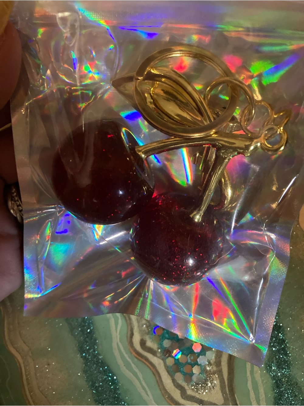 Source Unknown red glitter cherry bag charm